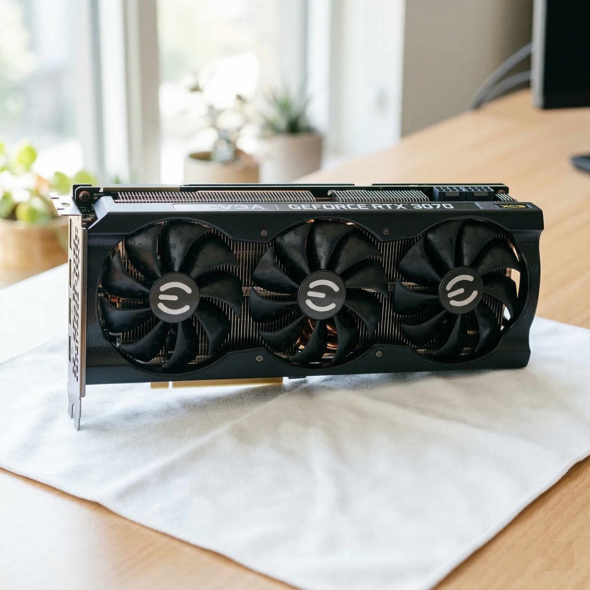 A freshly cleaned GPU photographed on a dark surface with its original box and accessories neatly arranged