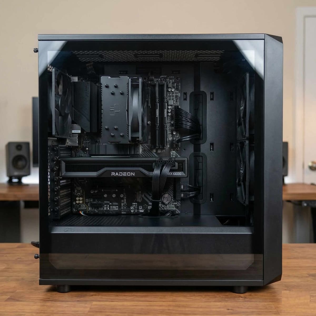 A partially assembled mid-range gaming PC with an RTX 3060 being installed into the motherboard